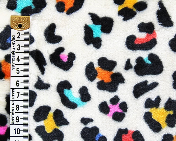 Leopard print cuddle polar fleece soft fabric. Multicolour on cream x 1/2 m.