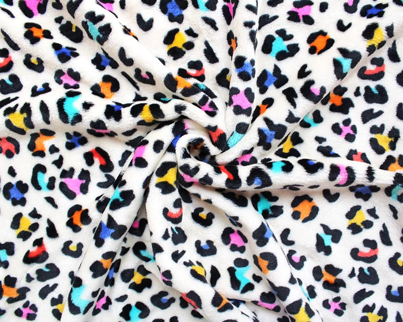 Leopard print cuddle polar fleece soft fabric. Multicolour on cream x 1/2 m.