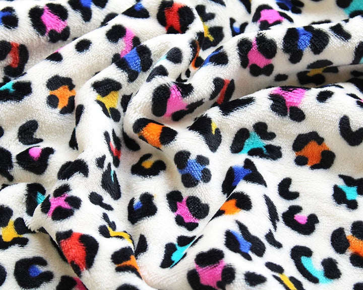 Leopard print cuddle polar fleece soft fabric. Multicolour on cream x 1/2 m.