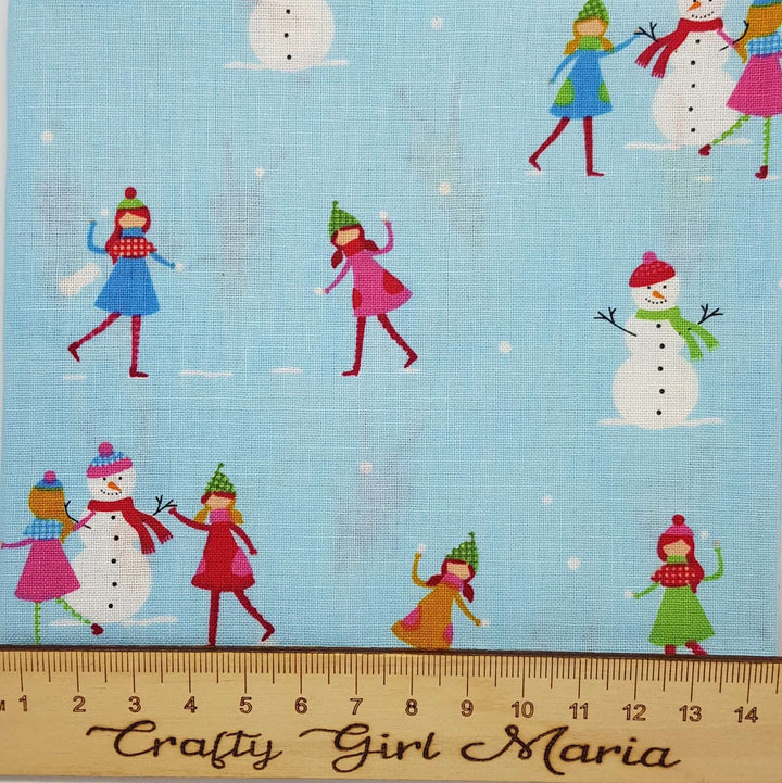 Christmas Town: Lights, Shopping and Snowman cotton fabrics. By the fat quarter.