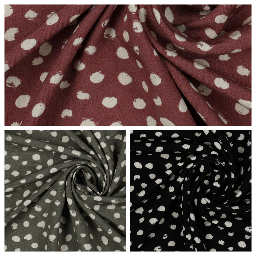 Random dots 100% Viscose Challis dress fabric by the half metre. Navy/green/black.