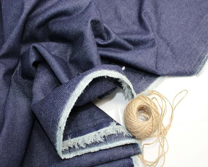 9 oz Stretch Denim: blue cotton 2% spandex. Dressmaking fabric. 86cm roll end