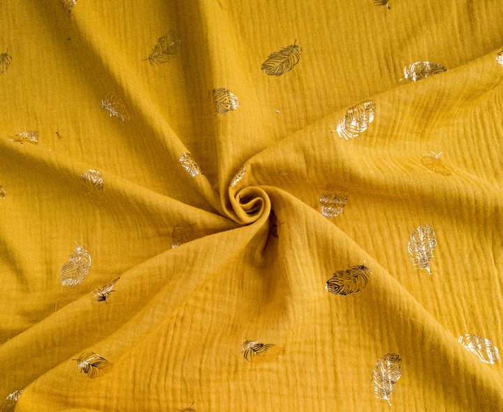 Metallic gold Feathers by Poppy double gauze dress fabric by the half metre. 100% cotton muslin